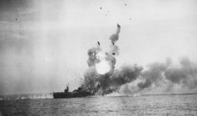 The USS St. Lo (CVE-63) explodes following a kamikaze attack during the Battle of Leyte Gulf